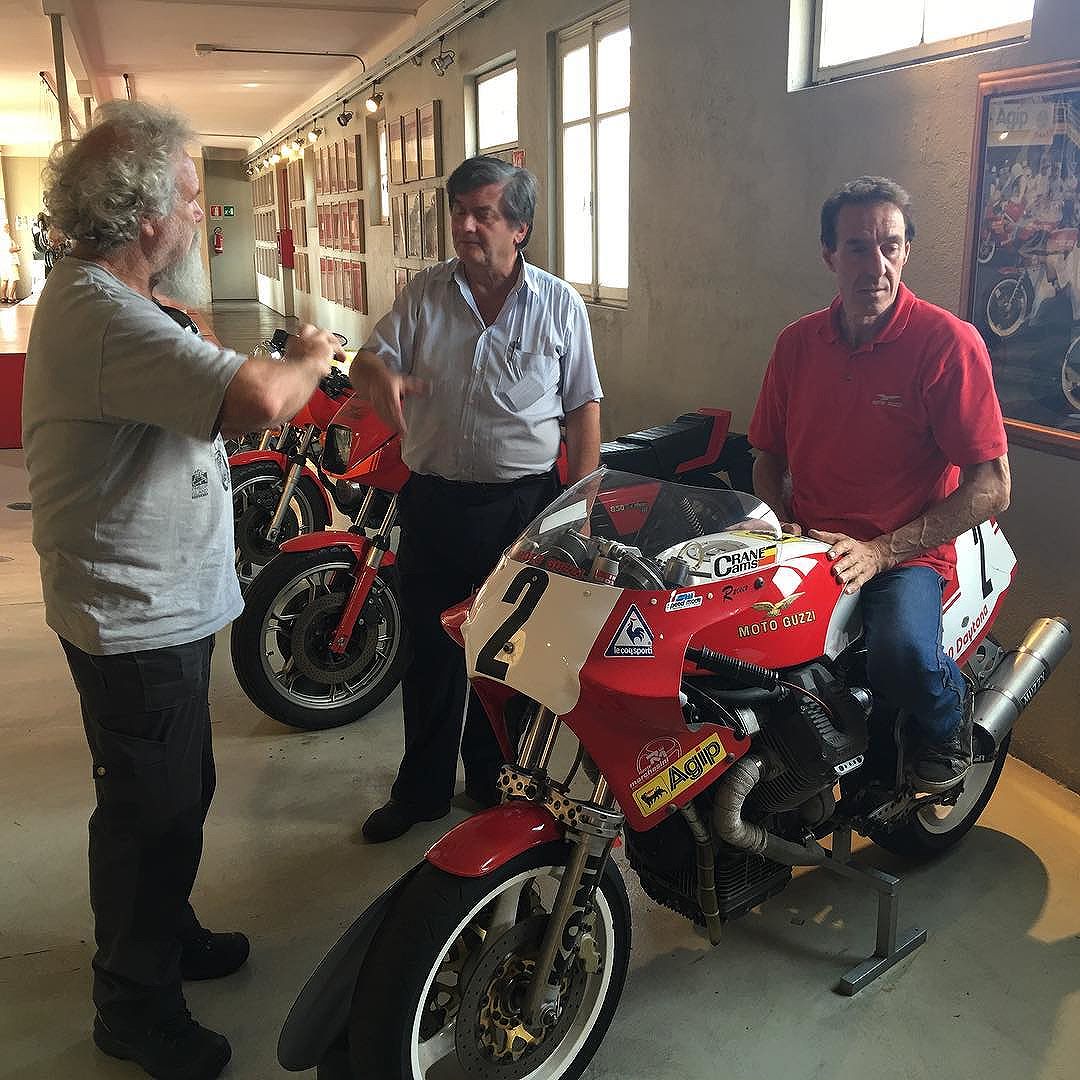 A big thrill for me last year was to visit the Guzzi factory museum each day. On this particular day I was fortunate to visit as a guest with Guzzi royalty. Pictured is Teo Lamers (owned the largest Guzzi dealership in the world), Giuseppe Todero ( son of the designer of the V8 Guzzi) and Alfio Micheli ( Guzzi factory test rider ). Not everyone gets to sit on the exhibits. The bike Alfio is on happens to be a Dr John inspired 4valve Daytona factory racer. The sand cast crank case is stamped “003”. #motoguzzi #guzziracer #bestdayever